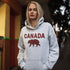Meet the Plaid & Proud Hoodie, featuring a rugged red & black plaid bear alongside "Canada" in matching plaid lettering—because nothing says “True North strong” like a bear rocking Canadian flannel.